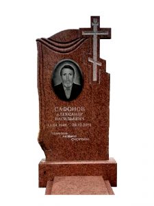 Памятник из красного гранита с крестом